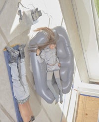 a doll laying on a couch